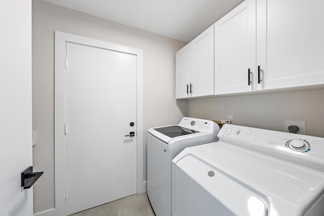 laundry room featuring cabinet space and independent washer and dryer