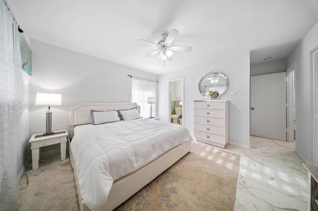 155 N Riomar Dr N, Port Saint Lucie, FL 34952 - bedroom with marble finish floor, a ceiling fan, and connected bathroom
