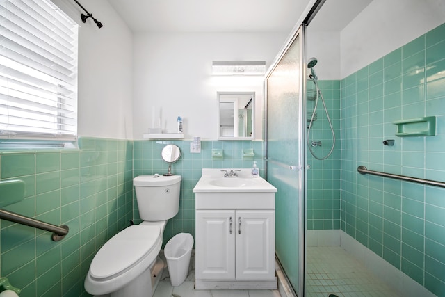 155 N Riomar Dr N, Port Saint Lucie, FL 34952 - bathroom featuring toilet, a stall shower, vanity, and tile walls