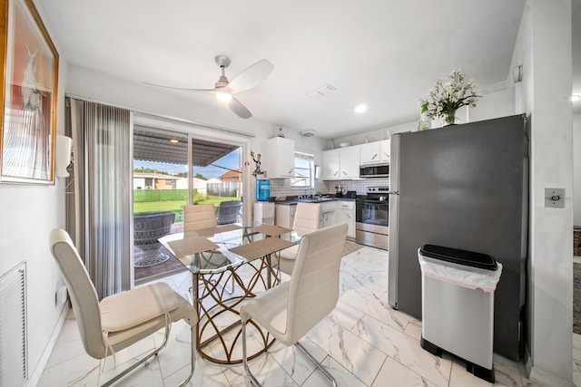 155 N Riomar Dr N, Port Saint Lucie, FL 34952 - dining room featuring visible vents, marble finish floor, and ceiling fan