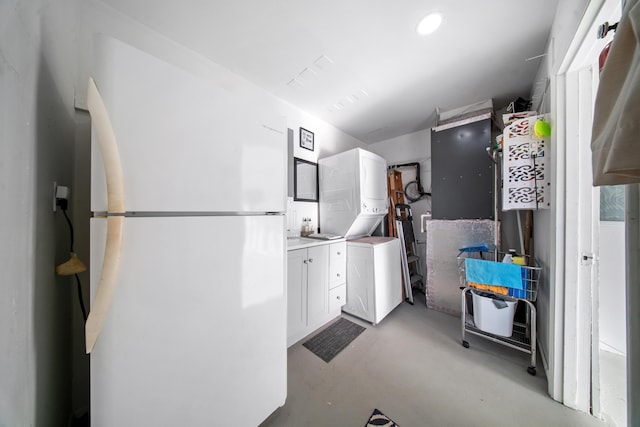 155 N Riomar Dr N, Port Saint Lucie, FL 34952 - interior space featuring freestanding refrigerator and stacked washer and clothes dryer