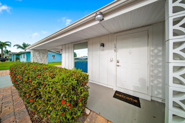 155 N Riomar Dr N, Port Saint Lucie, FL 34952 - doorway to property with board and batten siding
