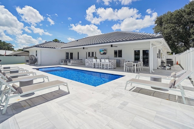 21830 Banyanwood Rd, Boca Raton, FL 33433 - view of swimming pool featuring an outdoor living space, french doors, a ceiling fan, central AC unit, and a fenced backyard