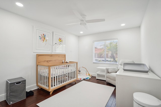 21830 Banyanwood Rd, Boca Raton, FL 33433 - bedroom featuring recessed lighting, a crib, and dark wood finished floors