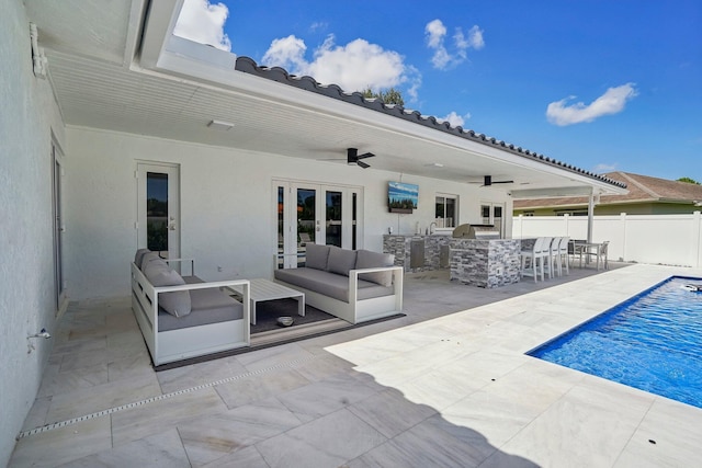 21830 Banyanwood Rd, Boca Raton, FL 33433 - view of swimming pool with outdoor dry bar, an outdoor living space, french doors, a patio area, and fence
