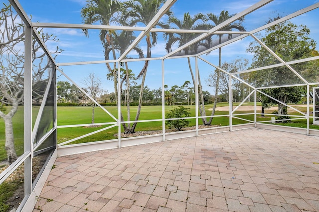 unfurnished sunroom with view of golf course