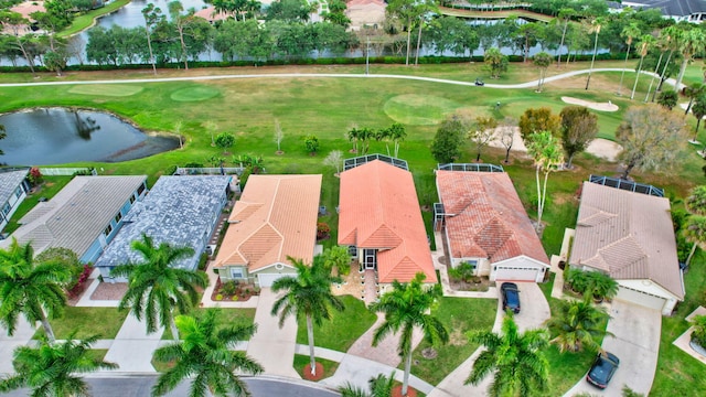 aerial view featuring a residential view, a water view, and golf course view