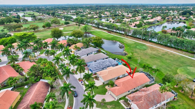 bird's eye view with a residential view, a water view, and view of golf course