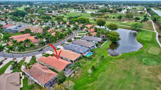 bird's eye view featuring view of golf course, a water view, and a residential view