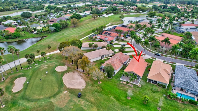 bird's eye view featuring a water view, a residential view, and golf course view