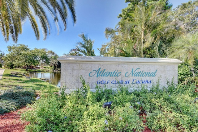 community sign with a water view