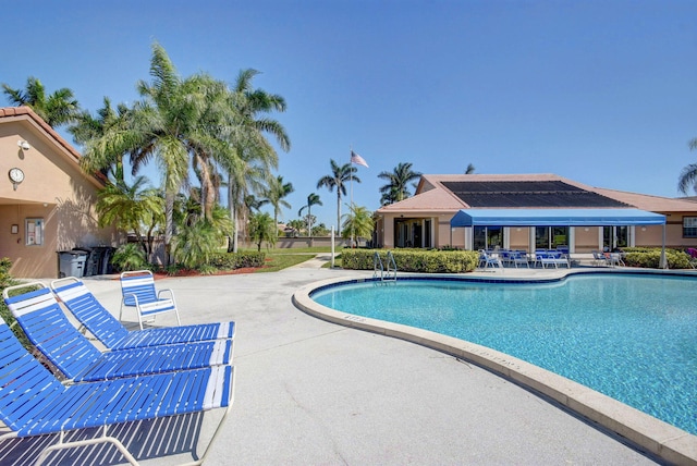 community pool featuring a patio
