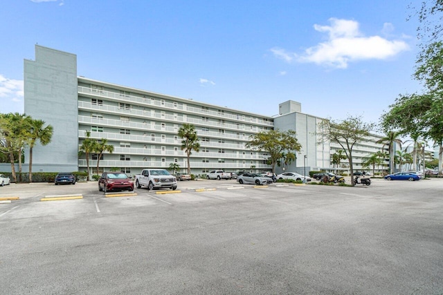 view of property featuring uncovered parking