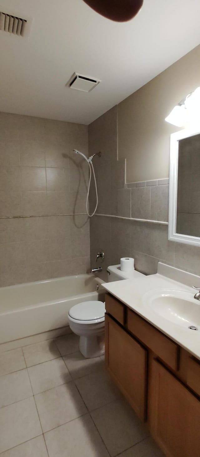 full bathroom with vanity, visible vents, shower / tub combination, and toilet