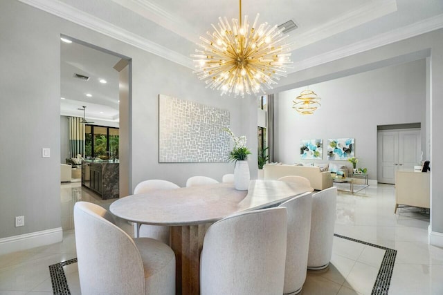 dining space featuring crown molding, an inviting chandelier, a tray ceiling, visible vents, and baseboards
