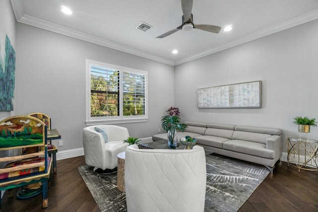 living area with baseboards, crown molding, visible vents, ceiling fan, and wood finished floors