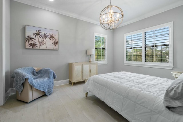 bedroom with baseboards, an inviting chandelier, ornamental molding, and wood finished floors