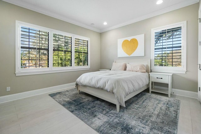 bedroom with recessed lighting, multiple windows, baseboards, and ornamental molding