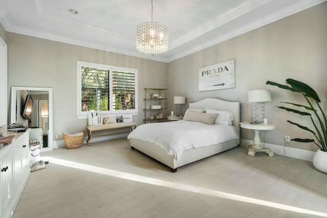 bedroom featuring a chandelier, baseboards, crown molding, and a raised ceiling