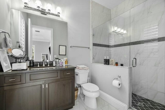 full bathroom featuring ornamental molding, toilet, a shower stall, vanity, and marble finish floor
