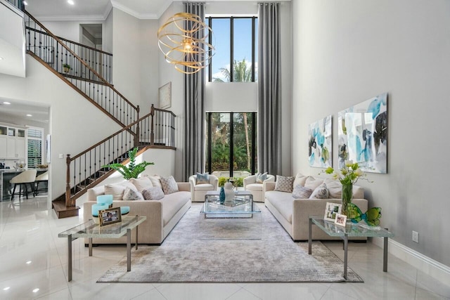 tiled living room featuring baseboards, a chandelier, crown molding, stairway, and a towering ceiling