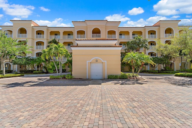 view of property with driveway
