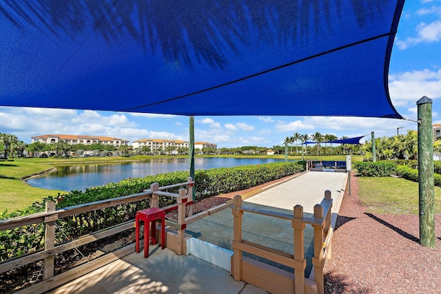 view of home's community with a water view