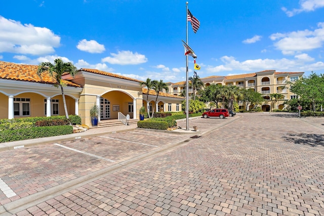 view of property featuring uncovered parking
