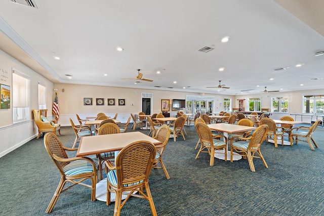 carpeted dining room with visible vents, recessed lighting, ceiling fan, and crown molding