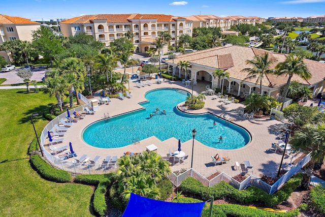 community pool with a patio area