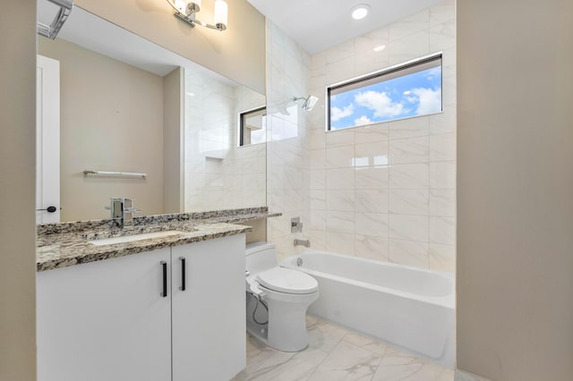 full bath featuring marble finish floors, vanity, shower / washtub combination, and toilet