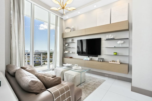 living area with tile patterned flooring, recessed lighting, and an inviting chandelier
