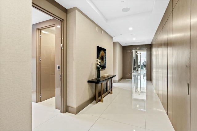 corridor featuring light tile patterned floors and recessed lighting