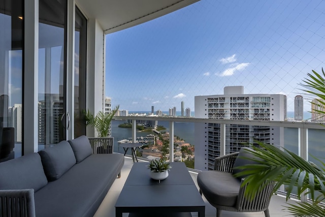 balcony featuring an outdoor living space and a view of city