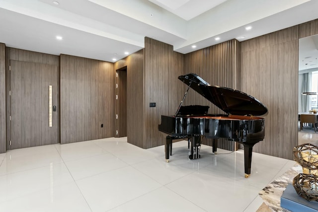 living area with tile patterned floors and recessed lighting