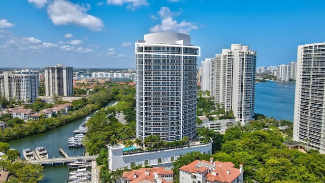 birds eye view of property featuring a view of city and a water view