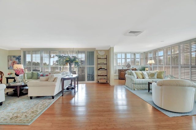 227 Brazilian Ave Ph D, Ph D, Palm Beach, FL 33480 - living area with healthy amount of natural light and light wood-type flooring