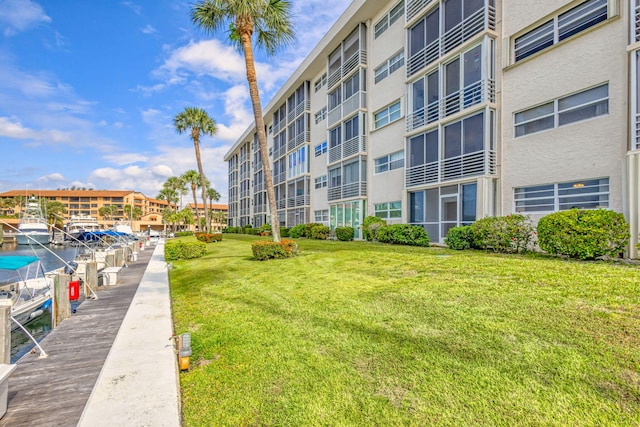 21 Yacht Club Dr Unit 102, North Palm Beach, FL 33408 - surrounding community with a lawn