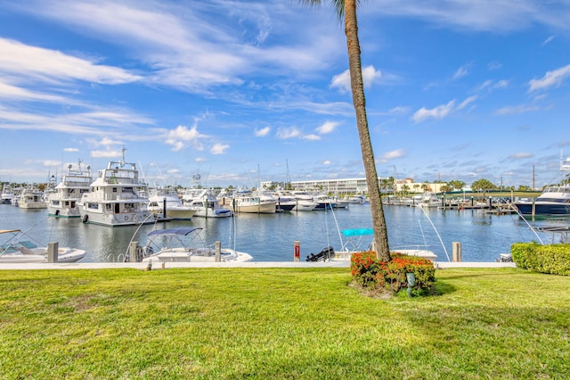 21 Yacht Club Dr Unit 102, North Palm Beach, FL 33408 - dock area featuring a water view and a yard
