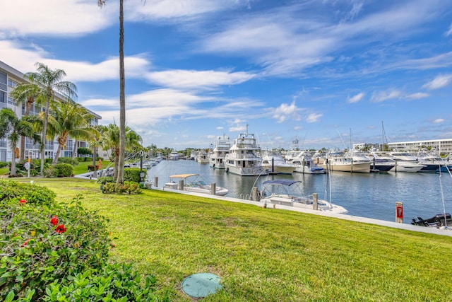 21 Yacht Club Dr Unit 102, North Palm Beach, FL 33408 - view of dock with a lawn and a water view