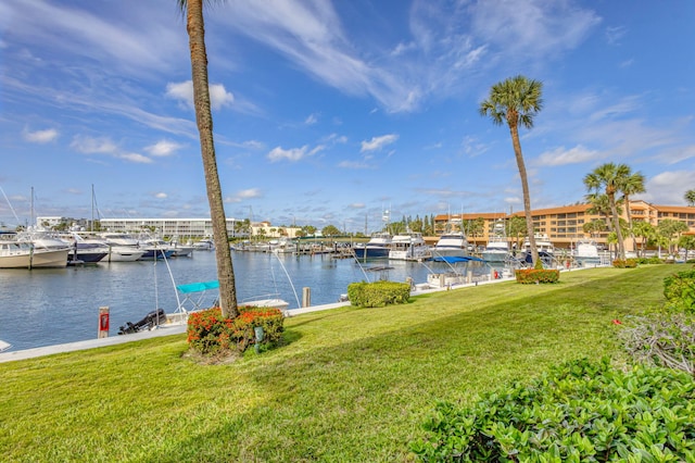 21 Yacht Club Dr Unit 102, North Palm Beach, FL 33408 - dock area with a lawn and a water view