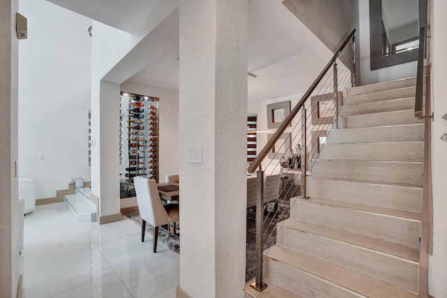 stairs featuring tile patterned floors