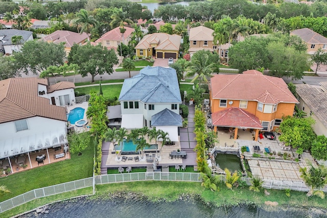 drone / aerial view featuring a residential view and a water view