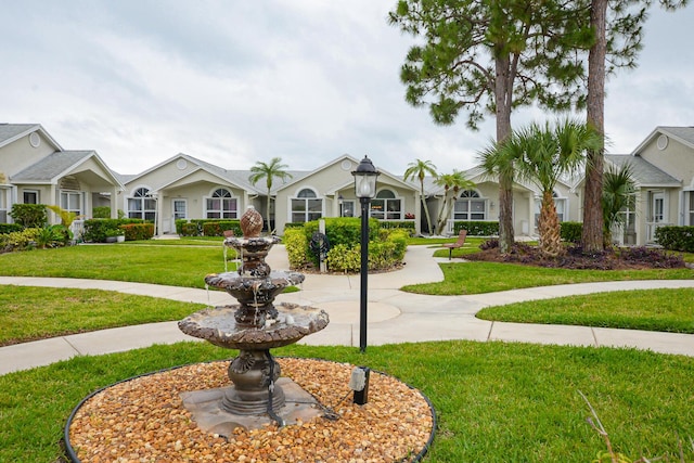 surrounding community featuring a lawn