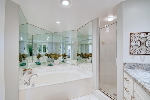 bathroom featuring a bath, recessed lighting, vanity, tile patterned flooring, and a stall shower