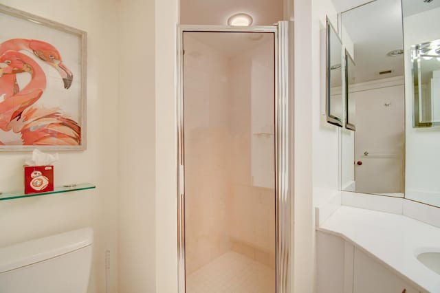 full bathroom with toilet, a stall shower, vanity, and visible vents