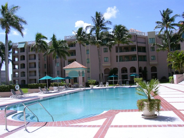 community pool featuring a patio area