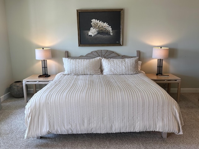 bedroom featuring baseboards and carpet floors