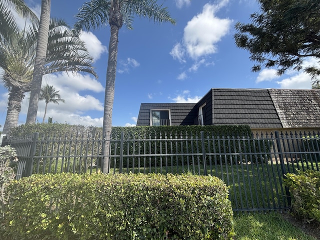 view of property's community featuring fence private yard