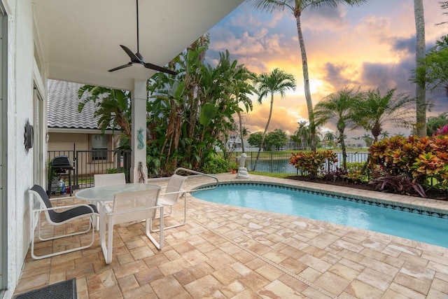 19699 Dinner Key Dr, Boca Raton, FL 33498 - view of swimming pool with a patio area, a water view, ceiling fan, fence, and outdoor dining area